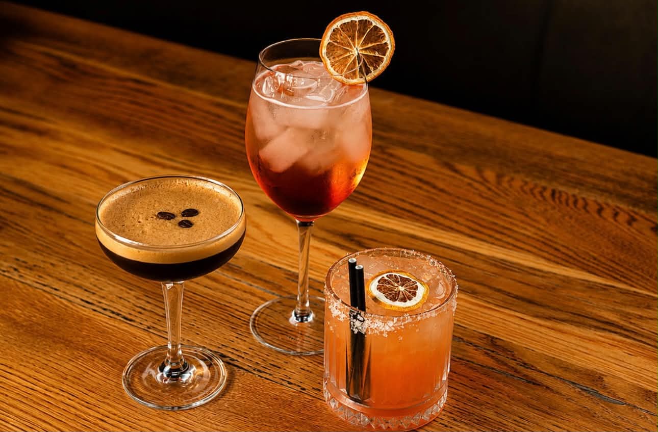 An espresso martini, an Aperol spritz and a margarita on the bar
